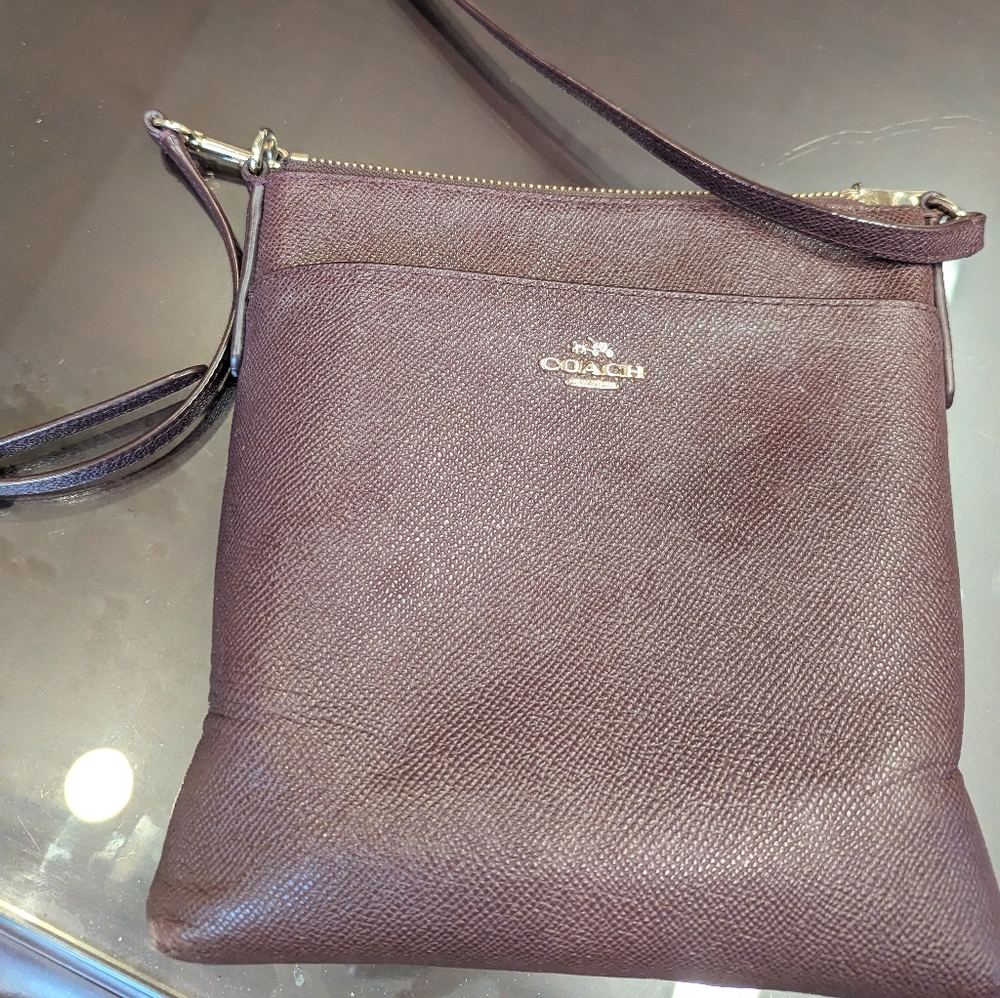 Maroon cross body Coach purse